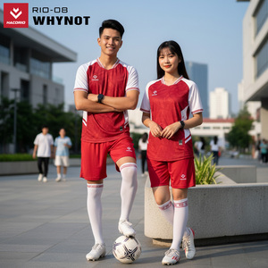 Green double couch with wooden legs