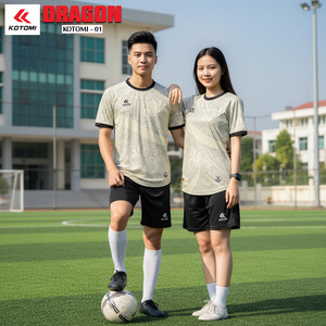 Green double couch with wooden legs