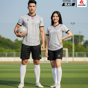 Green double couch with wooden legs