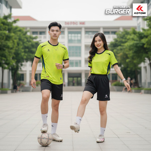 Green double couch with wooden legs