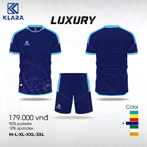 Green double couch with wooden legs