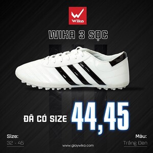 Green double couch with wooden legs