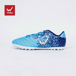 Green double couch with wooden legs