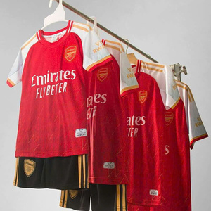 Green double couch with wooden legs