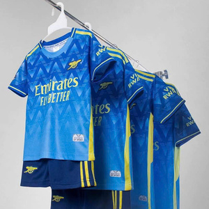 Green double couch with wooden legs