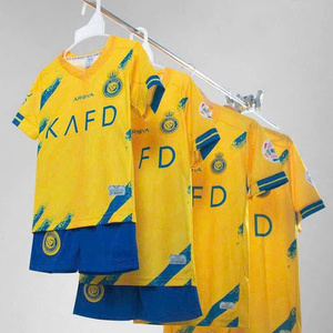 Green double couch with wooden legs