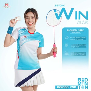 Green double couch with wooden legs