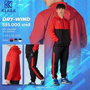 Green double couch with wooden legs