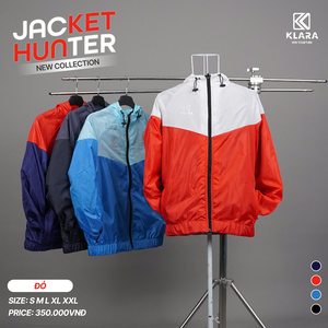 Green double couch with wooden legs