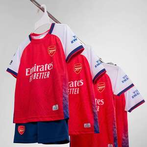 Green double couch with wooden legs