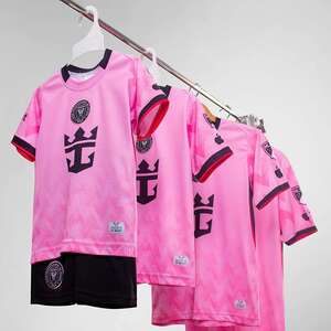 Green double couch with wooden legs