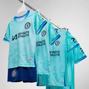 Green double couch with wooden legs