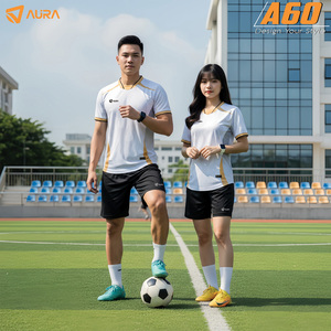 Green double couch with wooden legs