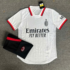 Green double couch with wooden legs