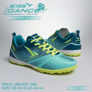 Green double couch with wooden legs