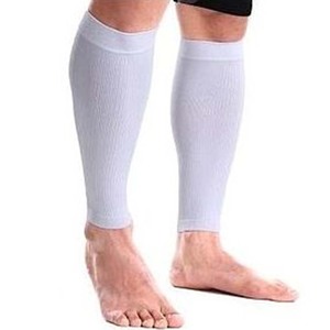 Green double couch with wooden legs