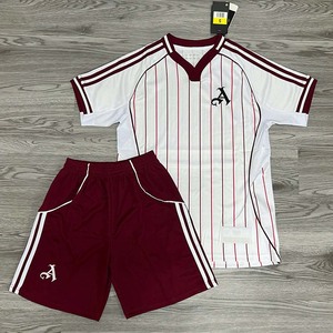 Green double couch with wooden legs