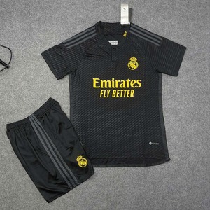 Green double couch with wooden legs