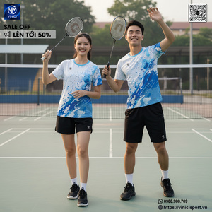 Green double couch with wooden legs