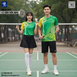 Green double couch with wooden legs