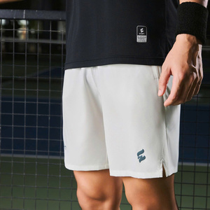 Green double couch with wooden legs